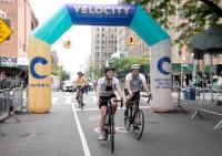 Bicycle riders arrive at the finish line at Velocity Ride 2018.